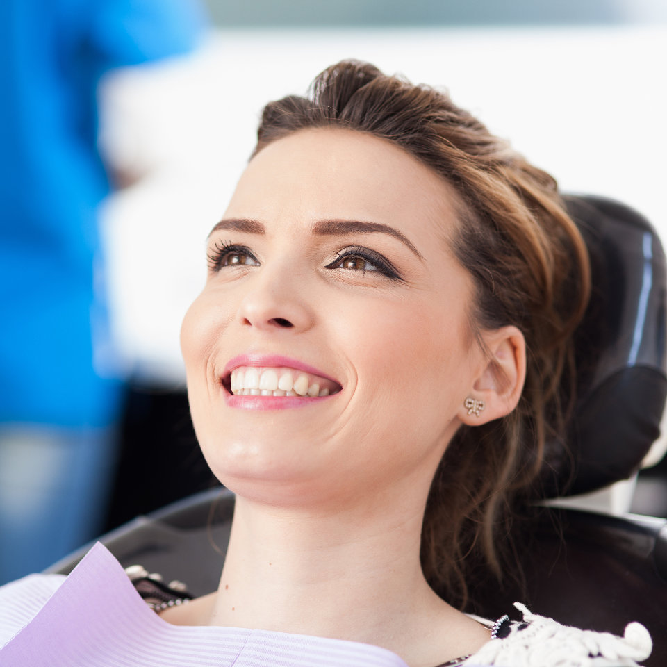 Satisfied woman sitting in the dental chair