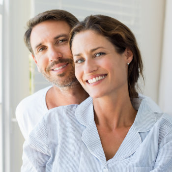 couple smiling warmly at the camera