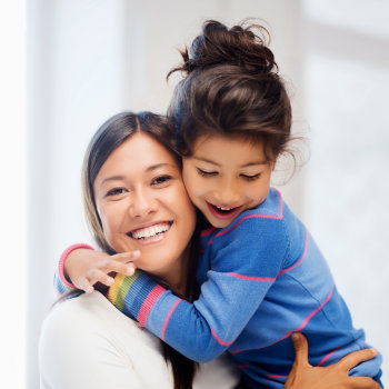 happy mother hugging her daughter