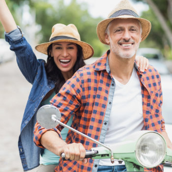 joyful mature couple with beautiful smiles