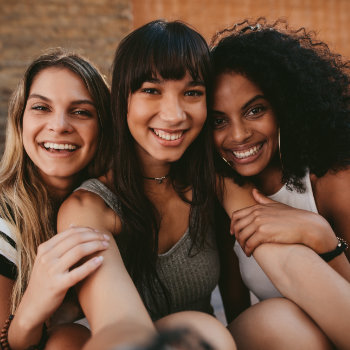 Three Beautiful Smiling Girlfriends