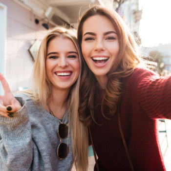 Two joyful attractive girls