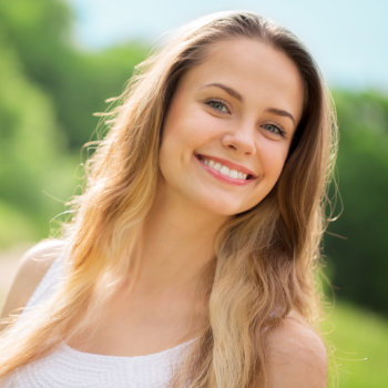 teenage girl smiles beautifully