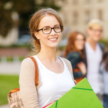 young smiling student in glasses