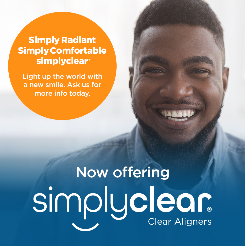 Smiling man next to a promotional text for SimplyClear clear aligners, advertising their new offering with a tagline about lighting up the world with a new smile.